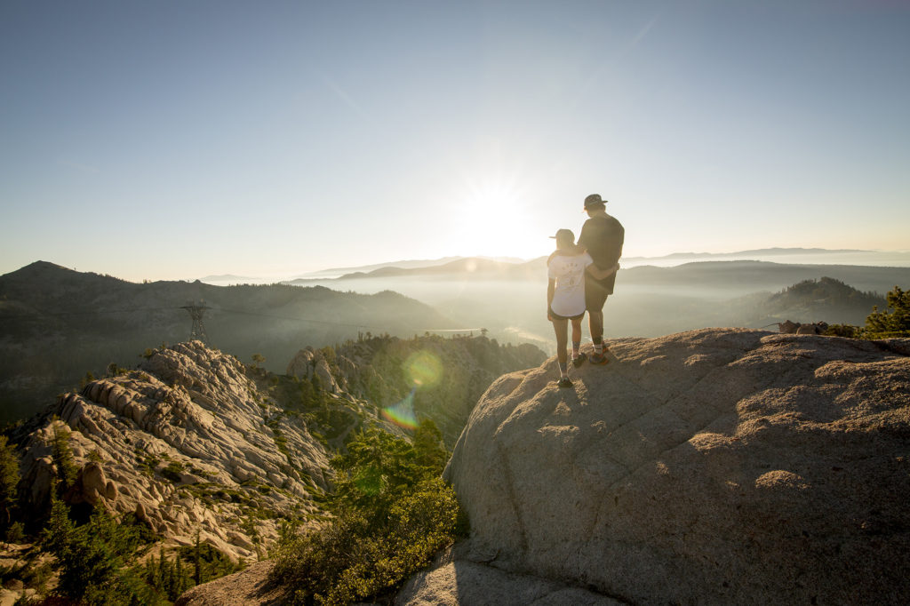 A couple hugging during a sunrise hike at Squaw Valley