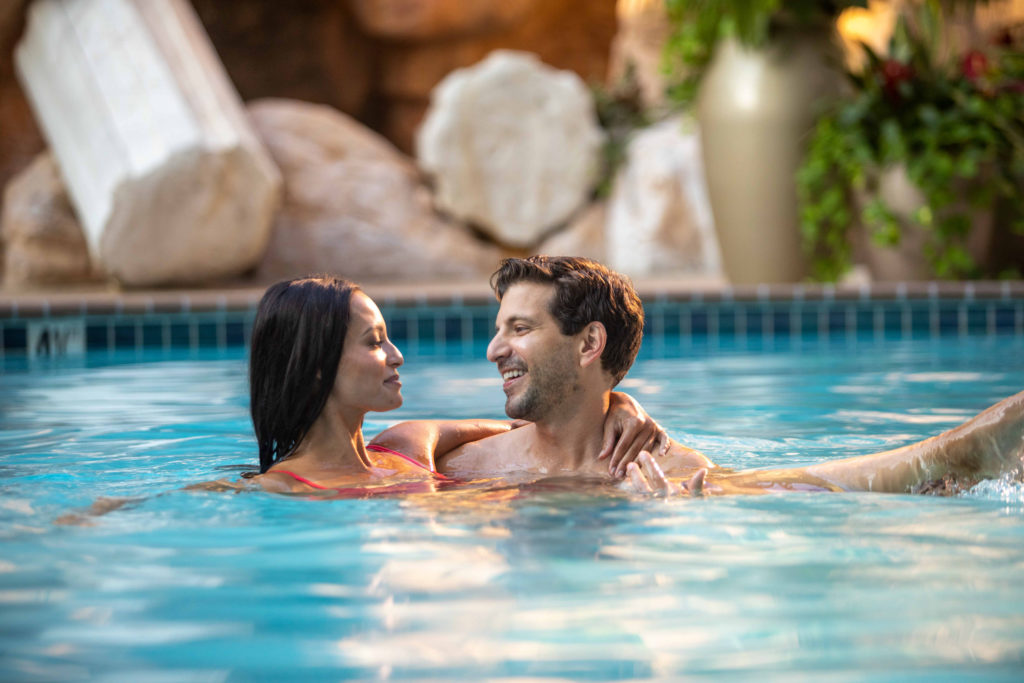 Couple in the pool at Atlantis Casino Resort Spa in Reno, NV